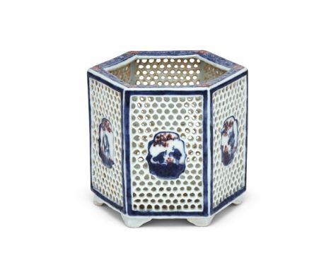 A rare Chinese blue and white and underglaze red 'honeycomb' brush pot, Qianlong, reserved with panels painted with various s
