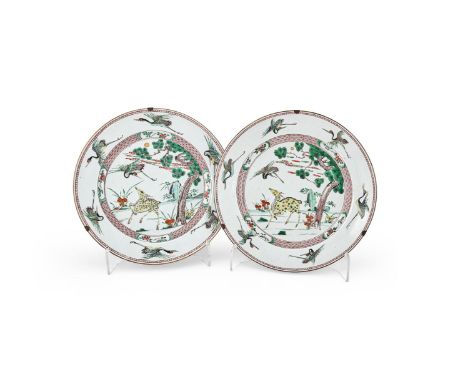 A large attractive pair of Chinese Famille Verte 'Deer and Crane' dishes, Kangxi, decorated with a prancing deer under a pine