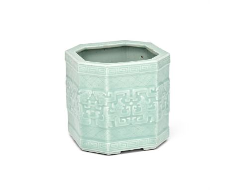A Chinese celadon 'Chilong' flower vase, Qianlong, moulded to the exterior with pairs of confronting archaistic dragons withi