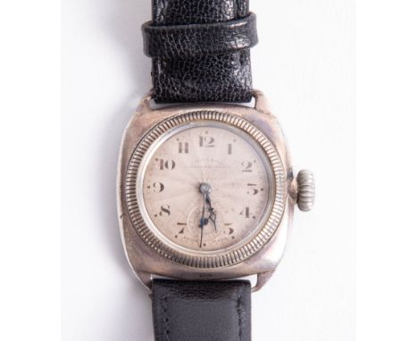 A vintage cushion cased silver wristwatch with manual movement and sub seconds, probably Rolex, indistinct names on dial.