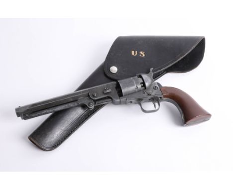 A replica U.S Naval pistol and U.S leather holster.