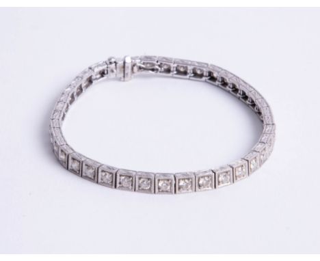 An 18k gold and diamond set bracelet, set with approx. 4 carats of diamond, assed colour J-K and assed clarity VS.