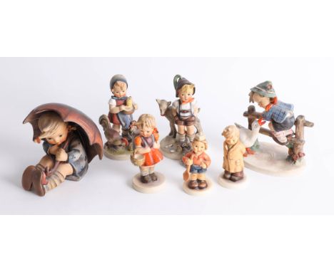 Seven Hummel figures including a large 'Umbrella Girl' group, height 13cm.
