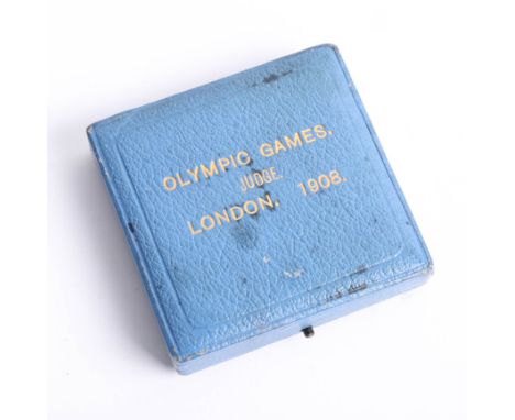 A London Olympics 1908 Judge`s commemorative medal by P. Vaughton, the obverse depicting 'Flame' standing upon a globe with t