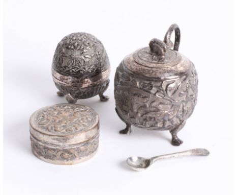 An Indian white metal pepper pot, sugar pot, and trinket box. (3)