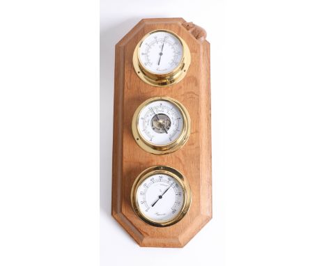 Robert Thompson Of Kilburn, a 'Mouseman' weather centre set with brass cased thermometer, barometer and hygrometer, with carv