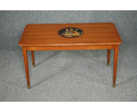 A vintage coffee table, 19th century style Continental satinwood with central painted cartouche. Maker's label to the undersi