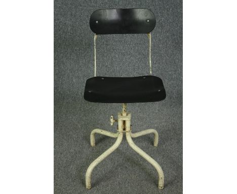 A vintage industrial machinist chair with swivel, adjustable action, marked TAN-SAD. H.80cm. 
