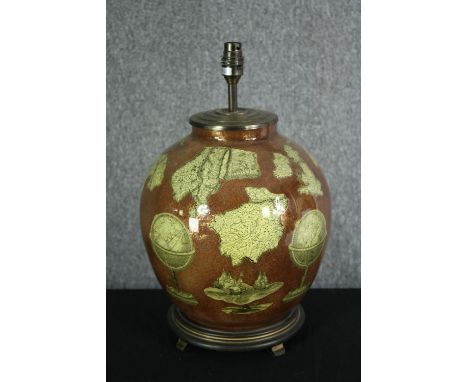 A contemporary lamp base of bulbous form decorated with old cartography motifs. H.43cm. 