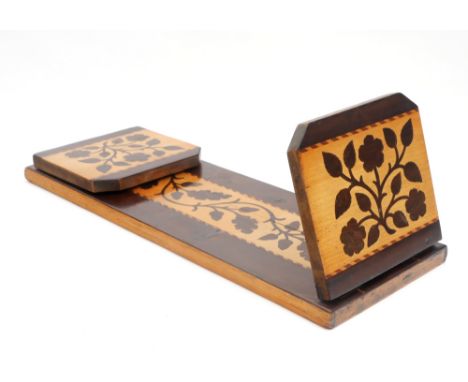 Victorian Killarney ware book trough. A mahogany and inlaid arbutus folding book trough, the base with a marquetry panel of o