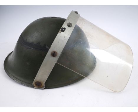 1970 Raglan Street, Falls Curfew, British Army steel helmet with visor. A British Mk IV steel helmet, fitted with a perspex v