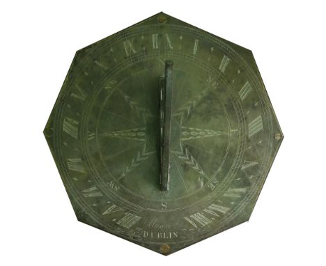 19th century Irish sundial, by Mason, Dublin. An early 19th century brass octagonal sundial, the scrolled gnomon centred on a