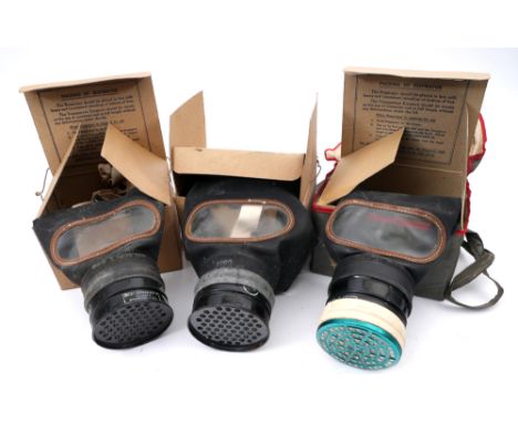 1939 three gas masks and a collection of militaria A 1939, Siebe Gorman, General Civilian Respirator, in leatherette carrying