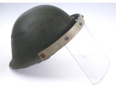Circa 1970 Northern Ireland, British Army steel helmet with visor. A British Mk IV steel helmet, fitted with a perspex visor 