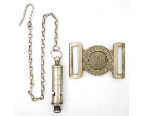 1922-1925 Poiliní Áth Cliath brass belt buckle and 'Dublin Police' whistle. A white metal two-piece belt buckle the centre wi