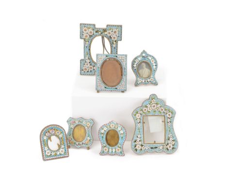 Seven micro mosaic picture frames, of various forms, all decorated with flowers upon light blue grounds, largest H9cm