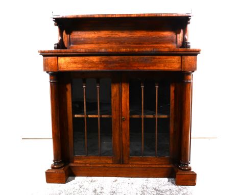 A Victorian rosewood chiffonier, raised shelf with three-quarter gallery, C-scroll supports, the base with a rectangular top,