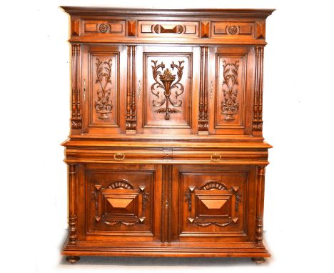 French walnut dresser, moulded cornice, the upper doors enclosing a shelf, the base with a rectangular top, frieze drawers ab