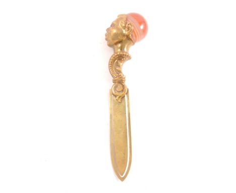 An unusual bookmark with head-shaped finial, garnet eyes and agate headwear.