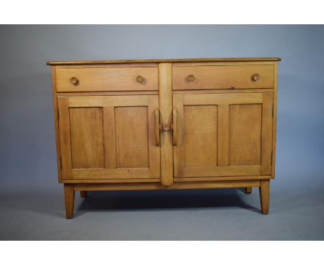 A 1970's Ercol Elm Sideboard with Two Drawers Over Cupboard, 129cm Wide