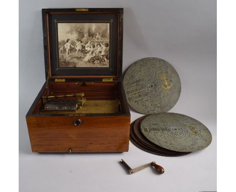 A Late 19th Century German Polyphon, Schutz Marke. The Hinged Lid Decorated with Inner Monochrome Print of Cherubs Playing Mu