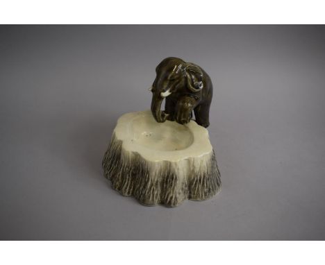 A Mid 20th Century Czechoslovakian Glazed Ceramic Ashtray/Bowl in the Form of an Elephant Stomping on Tree Trunk, 18cm High