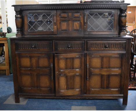 A Mid 20th Century Oak Court Cupboard with Three Drawers Over Cupboard Base and Raised Leaded Glazed Display with Plate Shelf