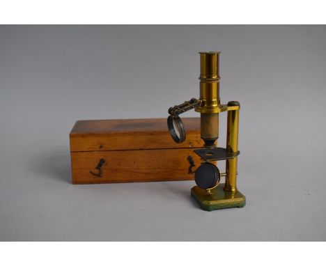 A Wooden Cased Brass Field Microscope with Condenser Lens 