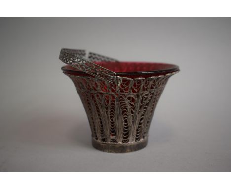 A Silver Filigree Basket with Loop Carrying Handle Having Ruby Glass Liner. Chip to Rim and Handle (AF). 10.5cm Diameter&nbsp