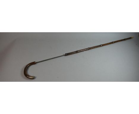 A Silver Mounted Swordstick. 83cms Long 