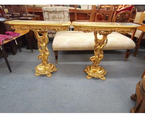A pair of modern Rococo style gilt console tables with figural pedestals, raised on paw feet, 76 h x 80 w x 27cm d 