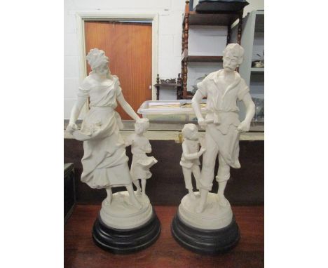 A pair of composition Parian style statues on faux ebonized style bases, depicting a flower girl and daughter, and a travelli
