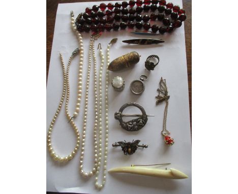 Four strings of pearls, one a necklace with a 9ct gold clasp, together with an Irish silver coloured brooch by West & Co, Col