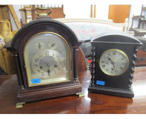 A Junghans mahogany cased bracket style mantel clock with brass feet and carrying handle, silvered dial with Arabi chapter ri