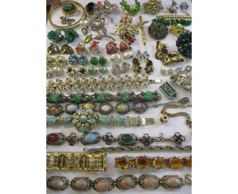 A collection of vintage jewellery to include paste brooches and earrings, hardstone and silver coloured bracelets and an enam