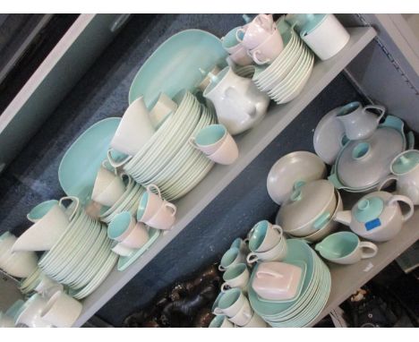 A large collection of mid 20th century twin-tone ice green and seagull Poole pottery coffee, tea and dinner service including