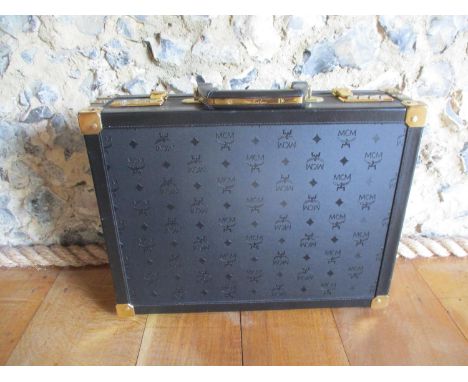 A vintage MCM black leather and canvas briefcase designed by Michael Cromer, the luxury goods founder, in new condition, pre 