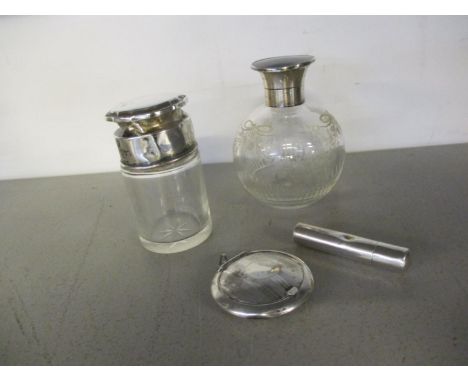 Two silver topped dressing table bottles to include a scent bottle, together with a 1912 silver needle case, and a 1923 silve