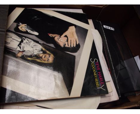 Record player together with LP records. 