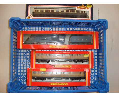 A tray of OO Gauge by Hornby Railways to include two LNER coaches in teak livery and a Mallard loco and tender together with 