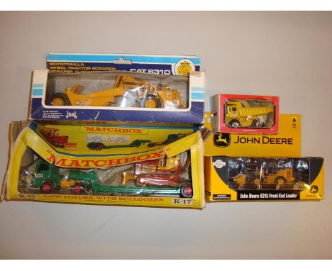 A group of boxed diecast vehicles to include a Matchbox K-17 Low Loader with Bulldozer and a Joal Cat 631D Wheel Tractor Scra