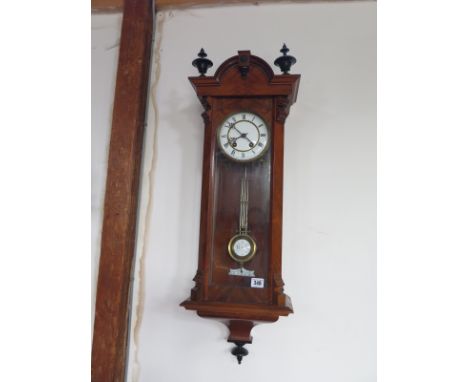 A 19th century walnut an ebonised wall clock by Lenzkirch - 8 day movement with white enamel dial striking hour and half hour