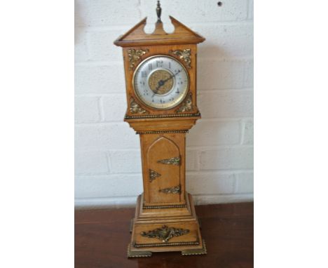 A miniature longcase clock with 8 day platform movement - oak case with brass applied decoration - Height 51cm - working in t