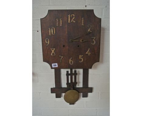 An Arts and Crafts oak wall clock - Height 68cm - not working