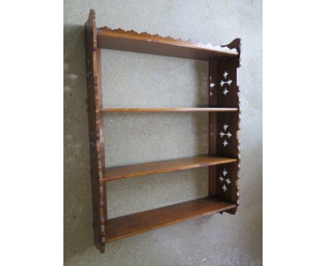 A Victorian Gothic carved four tier shelf - Height 77cm x 58cm x 14cm