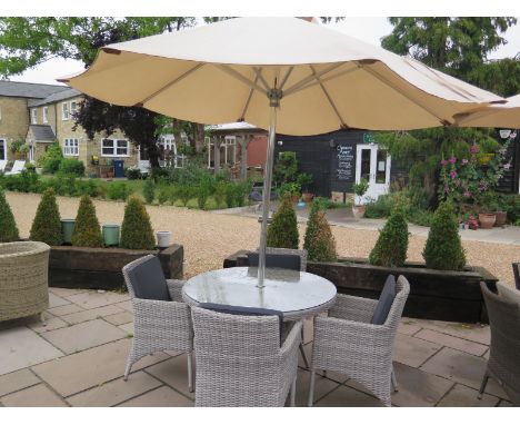 A Bramblecrest Chiltern 110cm round table with four armchairs including cushions, parasol and base