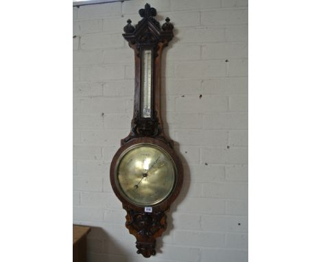 A Victorian oak barometer thermometer with ornate carving, dial signed T P CLARKE BEDFORD - Height 114cmCondition report: In 