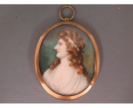A miniature portrait of a classical lady in an oval gilt frame - 7cm x 5cm 