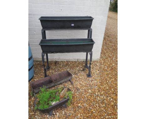 A cast iron two tier planter, a two section cast iron trough planter and a small cast iron planter - sizes: 76cm x 38cm x 92c