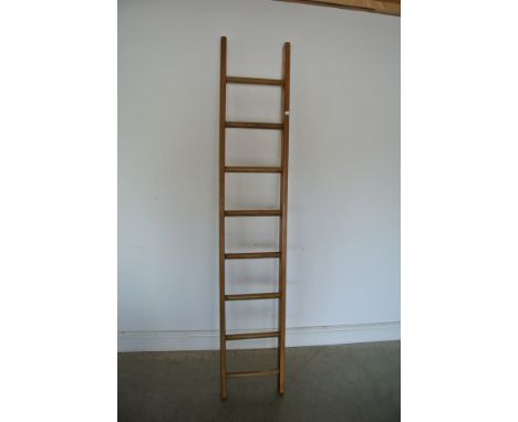 An eight rung wooden ladder - Stripped and waxed for decorative purposes - Height 214cm